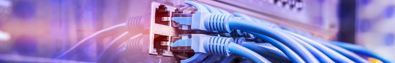 Ethernet cables plugging into a server rack Ethernet cables plugging into a server rack